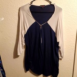Flowy tunic blouse with a front zipper and elbow length sleeves.